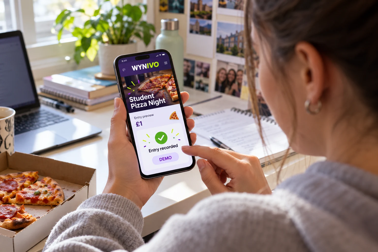 AI-created staged photo: an adult student holds a phone showing a demo WYNIVO Student Pizza Night entry confirmation. Not an actual entrant or entry.